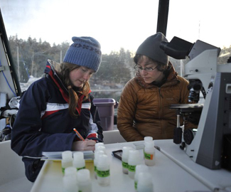 Robin Kodner and a student collecting data