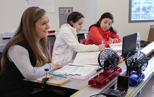 3 students working together in a group