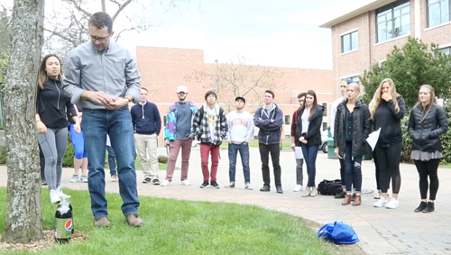 Professor Ed Love performing an experiment with Pepsi and Mentos