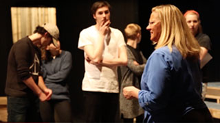 group of people in a tree making funny faces