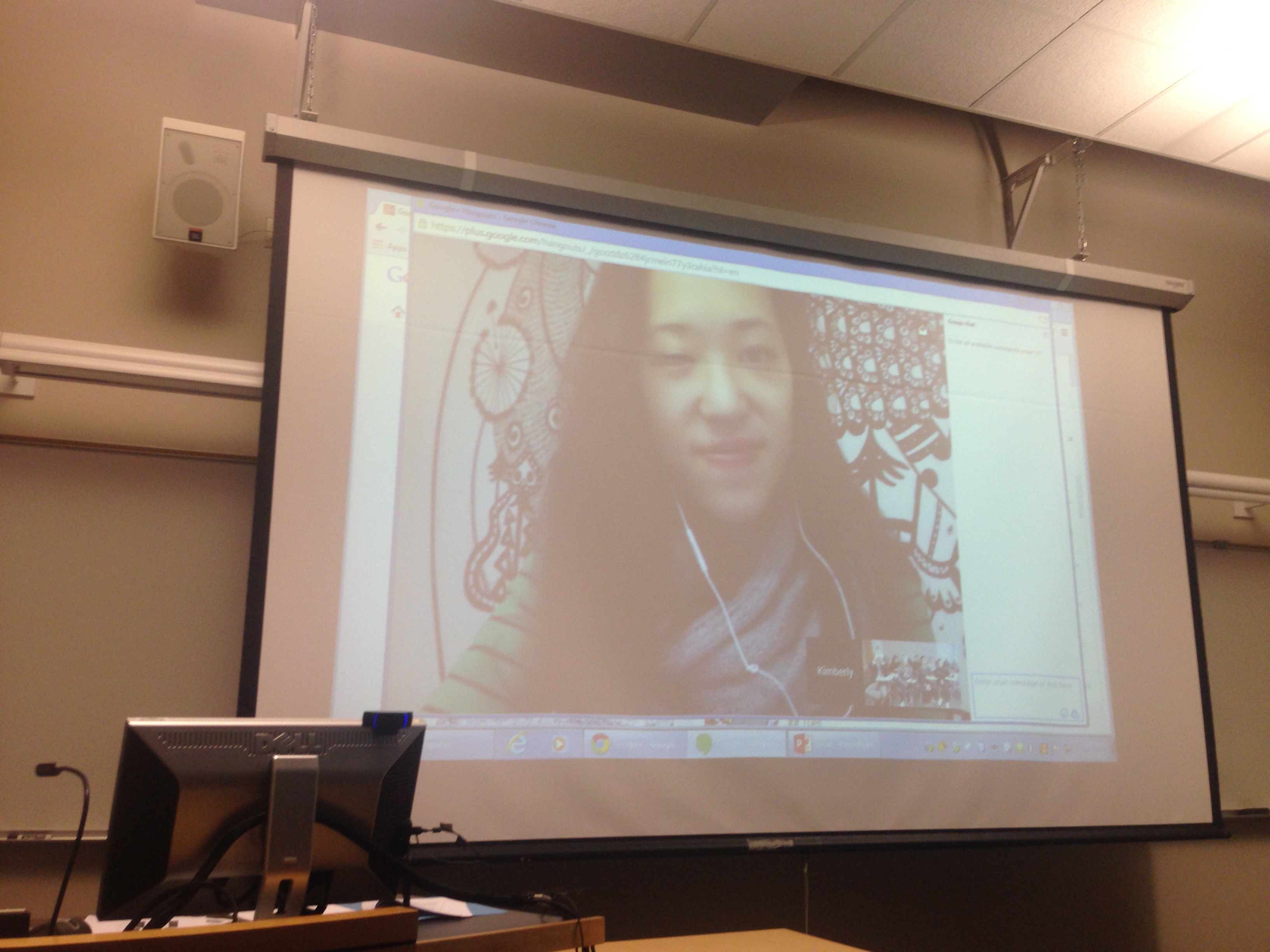 A projection of someone on a video chat